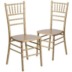 two wooden chairs sitting side by side in front of each other on a white background