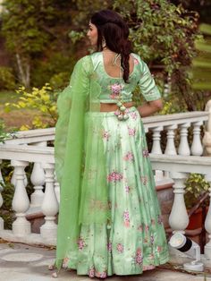 This Set Has Choli, Lehenga & Dupatta. Floral printed lehenga with organza sequins hand work dupatta. Color: Pistachio Green Fabric: Lehenga & Blouse- Satin Dupatta - Organza Product Details: Neck Type - Round neck Top Length - 14-15 inches Bottom Length - 40-42 inches Sleeve Length - 12 inches Note: The product will be delivered within 2-4 weeks of order placed Wash Care - Dry clean only Measurements: XXS : Chest = 32 | Waist = 28 | Hip = 34 XS : Chest = 34 | Waist = 30 | Hip = 36 S : Chest = 3 Semi-stitched Pista Green Choli For Eid, Green Art Silk Lehenga For Eid, Eid Green Art Silk Lehenga, Green Semi-stitched Dola Silk Sets, Green Dola Silk Bollywood Sets, Festive Unstitched Green Lehenga, Festive Green Unstitched Lehenga, Green Bollywood Dola Silk Sets, Bollywood Style Green Dola Silk Sets