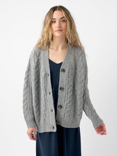 Indulge in cozy sophistication with our chunky Cable Knit Cardigan. Meticulously crafted from a blend of yak, alpaca, recycled nylon, and extra fine merino wool, this roomy midweight cardigan offers unparalleled warmth and texture. This chunky cable knit cardigan effortlessly elevates any outfit, making it a true staple in any wardrobe, with its generous and comfortable oversized fit. Due to the inherent quality of the natural fibers, you may notice shedding. Cozy Merino Wool Cable Knit Cardigan, Cozy Wool Cable Knit Sweater Coat, Merino Wool Cable Knit Outerwear For Layering, Merino Wool Cable Knit Cardigan For Layering, Cable Knit Merino Wool Outerwear For Layering, Cozy Merino Wool Cable Knit Outerwear, Wool Cable Knit Cardigan For Layering, Cozy Merino Wool Soft Knit Outerwear, Cozy Cashmere Knit Cardigan