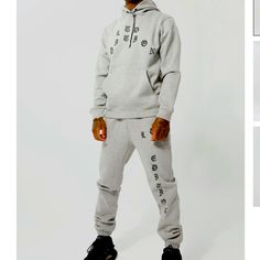 -Sold Out Online- An Essential For Any Streetwear Patron, A Hooded Tracksuit Has A Laid-Back Cozy Vibe That You Need To Keep Track Of. The Daily Drip Of Many A Rap, Trap, Sports Star, You're Gonna Want A Selection Of At Least 3 Boohoo Mens Tracksuits In Your Rotation. Look No Further, We Got You Mate, With Plain, Colour-Block And Graphic Printed Styles You Can Mix And Match For Infinite Fresh Looks. Details & Care 50% Cotton And 50% Polyester, Model Is 6'1" And Wears Size M Gray Tracksuit For Winter Streetwear, Gray Winter Tracksuit For Streetwear, Gray Tracksuit With Pockets For Sports, Gray Winter Tracksuit Sportswear, Gray Sporty Winter Tracksuit, Gray Hoodie Tracksuit For Winter, Gray Hooded Tracksuit With Drawstring Hood, Gray Athleisure Tracksuit With Drawstring Hood, Gray Hoodie Sporty Tracksuit