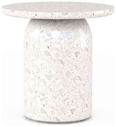 a white marble table with a circular top