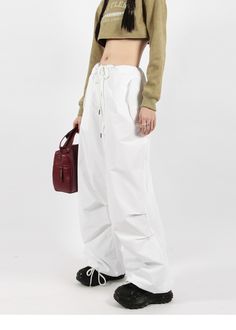 There’s a new trend in town, and it’s nightcity clothing’s Button Pocket Oversized Parachute Pants. These comfy, lightweight pants look great when paired with a crop top or graphic tee and sneakers. With a drawstring waistline, these pants are comfortable and secure, and the oversized fit gives them an effortless and chill look. Add these pants to your wardrobe, and you’ll never have a dull moment — you’ll always be ready for an impromptu night out, no matter how casual it might be.
Gender: Wome Urban Style Long Pants For Spring, Chic Baggy Pants For Streetwear, Trendy Loose Fit Spring Cargo Pants, Spring Trendy Wide-leg Parachute Pants, Trendy Wide Leg Parachute Pants, Chic Wide Leg Parachute Pants For Streetwear, Baggy Trendy Harem Pants For Spring, Trendy Wide-leg Parachute Pants With Relaxed Fit, Cotton Straight Cargo Pants For Day Out