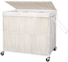 a white wicker laundry hamper with wheels on the front and bottom, attached to a cart