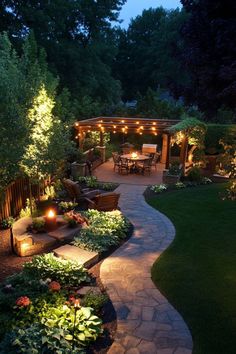 Well-lit backyard with a stone pathway, lush garden, and a pergola-covered seating area beneath string lights. Patio Pagoda Ideas, Large Yard Ideas Backyards, Backyard Twinkle Lights Patio, Ranch Patio Ideas Backyards, Garden For Small Backyard, Sloped Backyard Patio Ideas, Inviting Backyard Ideas, Chic Backyard Ideas, Trampoline Backyard Landscaping