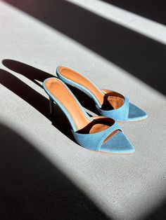 Gia is a minimal mule that will garner all the attention. Featured in Blue Denim with 80 mm heel (Also available in 120 mm). Size and Fit Information: U.S. Sizing Available in whole and half sizes Runs true to size (Some customers have sized up a half size since back is open) (Note: Not using leather and other materials from animals significantly reduces environmental impact, however, we acknowledge that synthetic alternatives are not without environmental concerns. As we grow, we are dedicated Environmental Concerns, Instagram Handle, Glass Slipper, Boot Pumps, Pumps Flat, Environmental Impact, Mule, Open Toe, Blue Denim