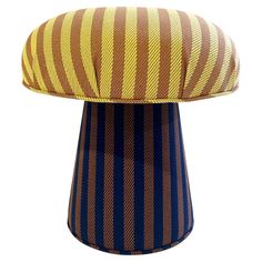 a brown and blue striped stool on a white background with the seat cushion up to it's top