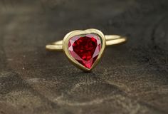 Heart Shaped Garnet Ring, 14k Solid Gold Ring, Garnet Engagement Ring, Bezel Set Solitaire Ring, January Birthstone, Wedding Proposal Ring    Main Stone: Garnet ( Lab - Created ) Main Stone Color: Red Main Stone Shape: Heart  Birth Month: January S I L V E R J E W E L R Y C A R E Silver is not the best friend of oxygen and sulfur; it can be oxidized and tarnished from time to time it is the nature of silver. To keep the silver shiny and prevent it from oxidizing fast, we would recommend the foll Engagement Ring Bezel, Garnet Engagement Ring, Ring Bezel, Solitaire Setting, Fancy Gifts, Solid Gold Ring, January Birthstone, Garnet Ring, Proposal Ring