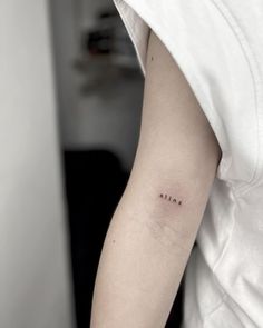 a person with a small tattoo on their arm