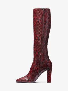 Statement boots dominated the Fall/Winter 2023 runway, and the Carly was undisputedly one of the most noteworthy offerings. Crafted from python-embossed leather, this towering pair features a sleek pointed toe and stands on a wrapped block heel for elegant height. A subtle side zip fastening makes for ease of wear while keeping the silhouette streamlined. Luxury Calf Leather Platform Boots For Fall, Luxury Knee-high Platform Boots, Luxury Formal Platform Boots, Luxury Calf Leather Heeled Boots For Fall, Luxury Platform Boots For Formal Occasions In Fall, Luxury Platform Boots For Formal Fall Events, Luxury Formal Platform Boots For Fall, Luxury Knee-high Boots With Reinforced Heel For Winter, Luxury Winter Knee-high Boots With Reinforced Heel