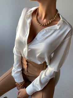 The Rina Satin Blouse is perfect for all occasions. Constructed of a silky satin, it is soft and comfortable yet lays just right around our curves. The buttons match the blouse throughout for a clean look. Available in White, Black, Chocolate, Petal Purple and Pink Roses. White Satin Blouse, Satin Bluse, Black Chocolate, Womens Blouses, Satin Blouse, White Satin, Pink Roses, Womens Clothing Tops, Roses