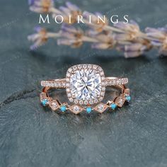 a diamond ring with blue stones on it and the words mohriings above it