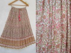 "ITEM DESCRIPTION golden pink flower printed cotton long maxi skirts - ethnic wear bohemian look maxi skirts Material: 100% cotton voile soft crinkled fabric Length: - 38 inch long Waist :-28.00 inch full (14 inch half) 28 inch relaxed can stretch up to 50 inch Size: free size (fit to all) PRODUCT NAME: - Long Women Maxi skirts Ladies Vintage Long skirts Company Return Policy: Please write for more information to my email directly CHOOSE \"ASK SELLER QUESTION \" payment policy:- we accepts payme Bohemian Maxi Length Pink Skirt, Bohemian Pink Maxi Skirt, Bohemian Pink Floral Print Maxi Skirt, Traditional Pink Skirt For Spring, Bohemian Cotton Pink Skirt, Bohemian Pink Cotton Skirt, Pink Bohemian Cotton Skirt, Traditional Pink Skirt For Summer, Traditional Pink Summer Skirt