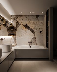 a modern bathroom with marble walls and flooring, including a bathtub in the center