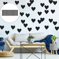 a living room with black hearts on the wall