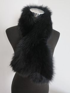 a black fur collar on a mannequin