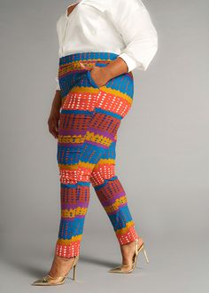 Style#4022OTA Our Talia African Print Stretch Pants are designed for the modern individual who values both flexibility and fashion. Meaning 'to bloom' in Arabic, these flattering skinny pants adapts to your lifestyle, providing the flexibility that you need without compromising on fashion. Wear with your favorite pair of boots, heels, or sneakers and pair with our Uyai stretch blazer. *Colors may look slightly different depending on the fabric used for construction* Item photographs brighter. Se Multicolor Stretch Straight Pants, Multicolor Stretch Straight Bottoms, Vibrant Stretch Bottoms, Multicolor Stretch Straight Leg Pants, Orange Fitted Bottoms With Elastic Waistband, Fitted Orange Bottoms With Elastic Waistband, Multicolor Non-stretch Ankle-length Pants, Multicolor Stretch Ankle-length Pants, Fitted Orange Ankle-length Pants