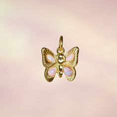 Butterfly Charm - Opal - Add a little magic with our adorable butterfly charm to add to any chain necklace or bracelet. Made with precious lab-grown opals & gold! Wildflower + Co. Jewelry ♥ Measurements: approx. 3/4" h  ♥ Materials: 12k polished gold plating,  & synthetic opals ♥ Designed by & exclusive to Wildflower + Co.  ♥ Lead, nickel & cadmium safe  ♥  Intended for use by adults only  ♥  Imported Mother's Day Butterfly Jewelry With Butterfly Charm, Mother's Day Jewelry With Butterfly Charm, Mother's Day Butterfly Charm Jewelry, Pink Butterfly Charm Pendant Jewelry, Butterfly Charm Jewelry For Birthday, Pink Butterfly Dainty Necklace, Cute Silver Jewelry With Butterfly Charm, Dainty Pink Butterfly Necklace For Gift, Dainty Pink Butterfly Necklace As Gift