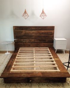 the bed frame is made out of wood and has no headboard or foot board