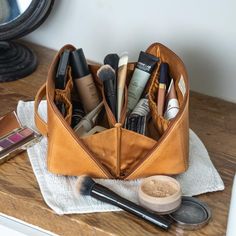 Transform your daily routine with our Essentials Makeup Bag, meticulously handcrafted from premium full-grain leather. This stylish, versatile bag is perfect for everyday use, travel adventures, business trips, and beyond! A spacious, lined interior featuring three pouch pockets and one secure zipper pocket offers the perfect organized space for all your beauty must-haves. The unique diagonal zipper design allows for a wide opening, giving you a complete view of your makeup, toiletries, or small essentials, making them easy to access. Its sleek, flat design ensures you can find what you need quickly, while the convenient top handle means you can effortlessly grab it and go wherever your day takes you. More than just a makeup bag, it's your ultimate organizer for toiletries, brushes, and sm Mens Work Bags, Makeup Bag Organizer, Womens Work Bag, Makeup Bag Travel, Women Backpack Travel, Travel Makeup Bag, Leather Toiletry Bag, Makeup Bag Organization, Mens Travel Bag