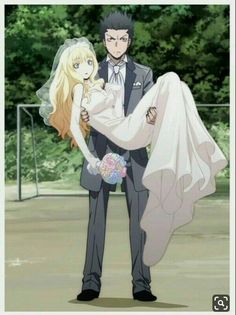 a man in a suit and tie holding a blonde haired woman wearing a wedding dress