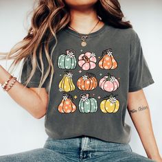 🎃 Comfort Colors T-Shirt | Pumpkin Season Shirt | Funny Fall Shirt | Halloween Pumpkin Tee Description: Embrace the fall season in style! This soft Comfort Colors t-shirt is the perfect way to celebrate pumpkin season. Fun and cozy, this shirt is ideal for showcasing your love for both autumn and Halloween. It's a great gift option for pumpkin lovers of all age. Soft Comfort Colors fabric Fall and Halloween-themed design Available in various sizes Fall Shirt, Pumpkin TShirt, Halloween Apparel 👉Experience the soft, vintage touch and a laid-back fit with Comfort Colors T-Shirts.  Crafted from 100% ring-spun cotton for ultimate comfort. To achieve an oversized look, we recommend sizing up by two sizes. ✨Care Instructions✨ 👉Wash item inside out in cold water, do not bleach, do not dry clean Multicolor Cartoon Print Tops For Fall, Casual Fall Shirt With Cartoon Print, Fall Gray Graphic Print T-shirt, Fall Cotton Shirt With Cartoon Print, Gray Graphic Print T-shirt For Fall, Green Cartoon Print Top For Fall, Green Cartoon Print Tops For Fall, Relaxed Fit Cartoon Print Top For Fall, Casual Fall T-shirt With Cartoon Print