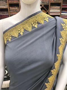 A Marvellous Embroidered Kashmiri Saree which you can wear at any party or wedding. - - - - - - - - - - - - - - - - - - - -  Product Details - Condition: Brand New - Dress Style: Kashmiri Saree - Embroidery: Zari/Tilla Hand Embroidery - Colour: Grey - Embroidery Colour: Gold F A B R I C Saree: Pure Crepe Blouse: Pure Crepe F I N I S H - Unstitched You can get it stitched locally. - Stitched Want your blouse ready to wear, let us know the style you want and we will stitch it for you. PLEASE NOTE: We would require you to share certain precise body measurements to stitch the blouse.  If you require guidance on how to take your measurements, please drop us a message. - Blouses are not made to US/UK/EU sizing charts, they are made by measurement. - The buyer is responsible for accurate measurem Kashmiri Saree, Kashmir Embroidery, Saree Women, Bohemian Jackets, Summer Coats, Traditional Outfit, Women Dress, Traditional Outfits, Hand Embroidered