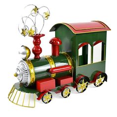 a green and red toy train with stars on it