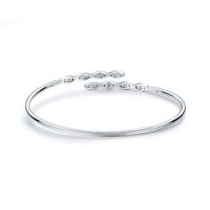 Discover the enchanting elegance of the 18K White Gold Hearts on Fire "Aerial Marquis Flexi" Bangle Bracelet. This exquisite piece beautifully showcases the brilliance of Hearts on Fire diamonds, meticulously designed for a timeless and sophisticated look. The bracelet boasts stations featuring both three and two round diamonds, creating a total of 24 stunning diamonds. The combined carat weight of these diamonds ranges from 0.50 to 0.58, and they are graded GH/VS-SI for color and clarity, ensur Hearts On Fire, White Gold Bangle, Gold Hearts, Diamond Bangles Bracelet, Loop Earrings, Fire Heart, Diamond Bangle, Heart Bracelet, Jewelry Creation