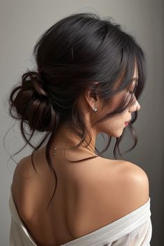 Use these 15 amazing updos with bangs to turn heads. Every haircut is created to have an eye-catching appearance. Hair Up With Bangs Wedding, Bridal Bun With Curtain Bangs, Updos For Moms Of The Bride, Wedding Hairstyle Bangs, Bridal Hairstyles Dark Hair, Wedding Bun With Bangs, Simple Low Updo Wedding, Wedding Hairstyles Unique, Romantic Wedding Hair Short