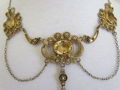 Circa 1900 Citrine Festoon Necklace by camelliacollection on Etsy Baroque Jewelry With Historical Design For Formal Occasions, Baroque Historical Jewelry For Formal Occasions, Baroque Historical Design Jewelry For Formal Occasions, Ornate Rose Cut Diamond Necklace For Formal Occasions, Victorian Baroque Yellow Gold Jewelry, Formal Baroque Hallmarked Jewelry, Victorian Baroque Formal Jewelry, Ornate Baroque Jewelry With Rose Cut Diamonds, Antique Round Necklace With Rose Cut Diamonds