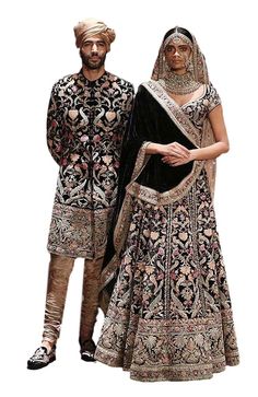 This black color Sherwani Jacket is in Velvet Silk embellished with fully hand-embroidery with resham threads, sequins, cutdana and kasab. Churidar is in beige colour silk fabric. Lakme Fashion Week 2016, Sabyasachi Bridal, Sabyasachi Lehenga, Nikkah Dress, Couple Wedding Dress, Bridal Lehenga Collection, Couple Dress, Indian Bridal Dress, Indian Bride And Groom