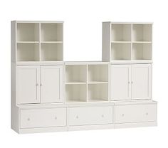 a white bookcase with drawers and cupboards on each side, against a white background