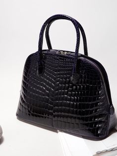 KRIS TALLEN's design, which combines classicism and post-modernism, aims for chic and produces crocodile bags that do not follow trends but add luxury through sturdy and sophisticated production that can be passed down from generation to generation. - Lightweight crocodile leather used- Practical design with three different structures- Can be worn in three ways: tote, shoulder or cross- Detachable strap for various styles Luxury Rectangular Shoulder Bag With Crocodile Pattern, Luxury Crocodile Pattern Shoulder Bag For Daily Use, High-end Rectangular Bag With Crocodile Pattern, Luxury Crocodile Pattern Satchel For Everyday Use, High-end Rectangular Crocodile Pattern Bag, High-end Travel Bags With Crocodile Pattern, High-end Top Handle Bag With Crocodile Pattern, Luxury Rectangular Satchel With Crocodile Pattern, High-end Crocodile Pattern Travel Bags