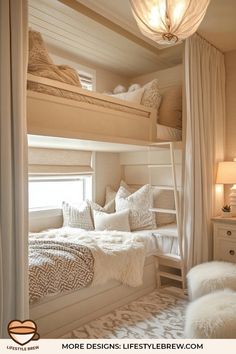 there are two bunk beds with white blankets and pillows on top of each bed in this room