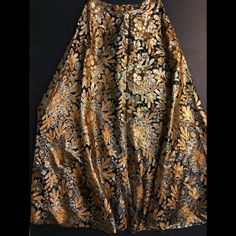 Eddy George California Vintage Long Full Skirt With Metallic Thread Floral Print Tag Says Size 16 But That’s A 1960/1970 Size 16. Measurement Across Waist Is 14.5” With No Stretch. Yes Ladies, Think 1960/1970! Length Is 42”. This Skirt Shimmers In True Mad Men Style. All The Thread Is Metallic. The Pictures Do Not Do This Skirt Justice. Fully Lined, With Back Hidden Zipper Closure. Full Skirt. Thread Belt Loops On Side. This Skirt Would Be Stunning Worn For Thanksgiving Dinner! Elegant Festive Maxi Skirt, Festive Long Silk Skirt, Festive Long Gold Skirt, Festive Gold Long Skirt, Traditional Gold Skirt For Party, Gold Traditional Party Skirt, Traditional Gold Party Skirt, Glamorous Gold Evening Skirt, Gold Long Lined Skirt