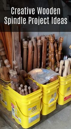 some yellow buckets filled with different types of wood