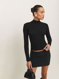 Layer up. Shop the Cori Ribbed Turtleneck Sweater from Reformation, a long-sleeve, lightweight sweater with a mock neckline and ribbing throughout. Black Turtle Neck Layered Outfit, Stretch Knit Top With Ribbed Neckline For Fall, Chic Ribbed Turtleneck For Fall, Chic Ribbed Long Sleeve Top With Stretch, Ribbed Fitted Long Sleeve Top For Layering, Chic Ribbed Collar Turtleneck For Fall, Fall Stretch Mock Neck Top With Ribbed Neckline, Stretch Ribbed Knit Top For Night Out, Chic Fitted Sweater With Ribbed Neckline