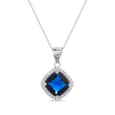 This gorgeous sterling silver necklace takes center stage with a dazzling blue CZ surrounded by a halo of sparkling diamonds. The perfect everyday accessory for adding a touch of glamour to any outfit. Elegant Blue Diamond Pendant Necklace, Blue Square Pendant Jewelry For Formal Occasions, Formal Blue Square Pendant Jewelry, Blue Diamond Pendant Necklace For Anniversary, Blue Sapphire Diamond Necklace As A Gift, Formal Blue Cubic Zirconia Necklace, Dazzling Sapphire Cubic Zirconia Necklace, Blue Diamond Necklace With Diamond Accents Gift, Blue Square Pendant Jewelry For Anniversary