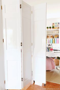 an open white door in a room