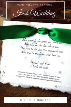 a wedding card with a green ribbon on it