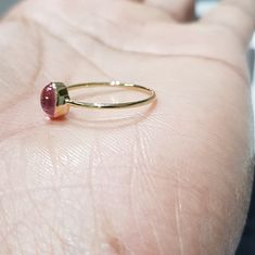 14k solid yellow gold natural oval shaped cabochon tourmaline semi precious gemstone ring. 1. The weight of the natural tourmaline gemstone used in the ring =0.65 cts. 2. The weight of the 14k solid yellow gold used in the ring =0.860 grms. The ring is very nice and beautiful. Thanks Fine Jewelry Ruby Oval Cabochon Ring, Oval Cabochon Ruby Gemstones, Oval Ruby Ring Stackable For Formal Occasions, 14k Gold Rings With Bezel Set Oval Cabochon, 14k Gold Cabochon Sapphire Ring, Fine Jewelry 14k Gold Sapphire Ring With Oval Cabochon, 14k Gold Rings With Bezel Setting And Oval Cabochon, 14k Gold Oval Cabochon Moonstone Ring, Yellow Gold Ruby Ring With Oval Cabochon