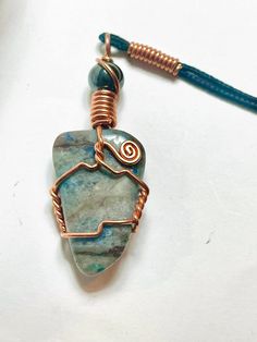 Handmade Copper Wire Wrap Necklace, Ready to wear with a high quality 24 inch black cord. Artisan Necklace With Adjustable Cord For Healing, Handmade Artisan Jewelry With Waxed Cord, Artisan Handmade Jewelry With Waxed Cord, Adjustable Copper Necklace With Cord, Handmade Artisan Necklaces With Waxed Cord, Handmade Artisan Necklace With Waxed Cord, Adjustable Copper Wire Necklace With Round Pendant, Handmade Waxed Cord Pendant Jewelry, Unique Waxed Cord Necklace As Gift