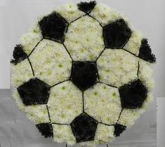 a soccer ball made out of white and black flowers