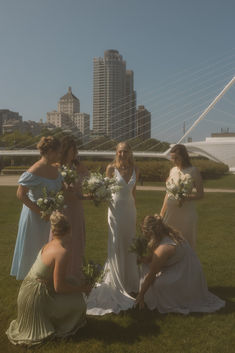 the bridesmaids are getting ready for their wedding in front of the city skyline