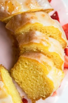 a close up of a doughnut on a plate with strawberries