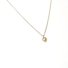 Embrace the timeless charm of love with our 14K solid gold Mini Puffy Heart Pendant Necklace. This delicate and elegant piece features a beautifully crafted heart pendant, measuring 5mm x 5.5mm, with a total height of 7.5mm including the bail. Perfect for celebrating love and affection, this necklace is a versatile accessory that adds a touch of warmth and elegance to any look. A heartfelt addition to your jewelry collection or a meaningful gift for someone special. Puffy Heart Necklace, Love And Affection, Puffy Heart, 21 Days, Heart Pendant Necklace, Heart Shape, Heart Necklace, Heart Pendant, Beautiful Jewelry