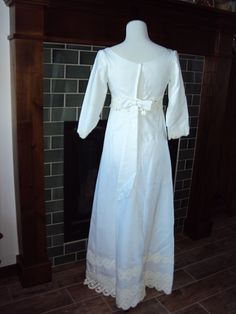 "Beautiful White Modest Linen And Venetian Lace Bridal Gown Size XS- S Excellent Vintage Condition, No Rips Or Tears, A Few Light Stains On The Bottom Inside Lining Of Train Fully Lined Empire Waist Dress Elbow Length Sleeves Rounded Boat Neckline Back Metal White Zipper (Zips Fine Too Small For My Dress Form) 6\" X 1.75\" White Bow Attached In Back Several Rows Of 3-5\" Venetian Lace Lace Is Slightly Differnt Shade Of White Very Fitted Bodice With Darts And Venetian Lace Around Empire Waist A L Regency Empire Waist Dress For Debutante Ball, Regency Style Empire Waist Dress For Debutante Ball, Regency Style Dress With Empire Waist And Historical Design, Regency Style Empire Waist Dress With Historical Design, Regency Style Empire Waist Wedding Gown, Regency Style Wedding Dress With Historical Design, Fitted Victorian Dress With Empire Waist And Historical Design, Empire Waist Dresses With Historical Design And Fitted Bodice, Fitted Historical Regency Gown