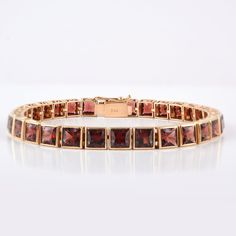 This is a classic style tennis bracelet. A must-have statement piece for every woman. It's a classic luxury to have. A perfect gift for your loved ones. -Material - 18K Solid Yellow Gold -Gemstone - Genuine Garnet -Gemstone Weight - 23.510 ct -Gross weight - 20.85 grams Garnet Benefits:- Helps ignite love and passion. Strengthens one's personal energy. Heightens creativity and inspiration. Improves one's daily energy levels. Establishes faith and trust. Opens the heart. Builds self-esteem. Promo 18k Gold Bracelet, Personal Energy, Daily Energy, Garnet And Gold, Bracelet Minimalist, Gold Armband, Garnet Bracelet, Birthstone Bracelet, January Birthstone