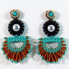 Brown, Black, Turquoise Green And Silver Glass Beads Frame A Sliver Dome With A Small Accent Of Magnesite. Handmade Beadwork. Post Style Earring Measures 2 1/4" High And 1 1/4" Wide. Southwestern Turquoise Earrings With Colorful Beads, Southwestern Style Blue Beaded Earrings, Turquoise Beaded Southwestern Earrings, Artisan Blue Jewelry With Dangling Beads, Southwestern Style Blue Jewelry With Dangling Beads, Artisan Turquoise Beaded Earrings, Unique Turquoise Earrings, Bead Frame, Green And Silver