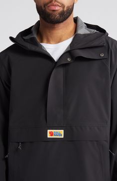 Hike the open trail in this durable, weather-resistant anorak simply styled with an adjustable hood and a trio of pockets. The loose fit and front/side zippers make it easy to pull on or take off and wear with other layers. Half-zip closure with snap storm placket; side zip closure Drawcord-toggle hood Adjustable hook-and-loop cuffs Flap kangaroo pocket; zip hand pockets Packable PFC-free durable water-repellent (DWR) finish Mesh lining 73% recycled polyester, 27% polyurethane Machine wash, tumb Practical Outerwear With Functional Pockets For Outdoor Activities, Hooded Hiking Outerwear With Functional Pockets, Functional Windbreaker With Drawstring Hood For Travel, Hooded Outerwear With Functional Pockets For Hiking, Outdoor Half-zip Windbreaker With Drawstring Hood, Hooded Outerwear With Functional Pockets For Outdoor, Hooded Outerwear With Functional Pockets For Outdoor Activities, Outdoor Parka With Functional Pockets, Black Half-zip Hiking Outerwear